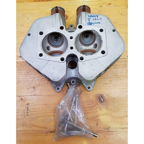 344 - A Triumph T140V ten stud cylinder head with three valves.