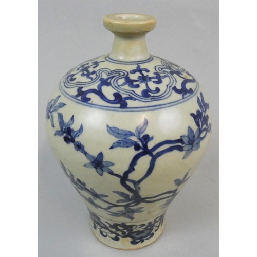 146 - An Asian inverted baluster vase, unmarked, with blue floral decoration, height 19 cm.