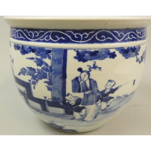 159 - A Chinese Qing dynasty blue and white jardiniere, decorated with a lady and two boys, height 19 cm.