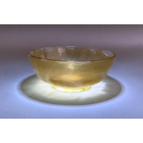 163 - A Chinese light brown jade bowl, probably late Qing Dynasty or Republican Period, of plain form with... 