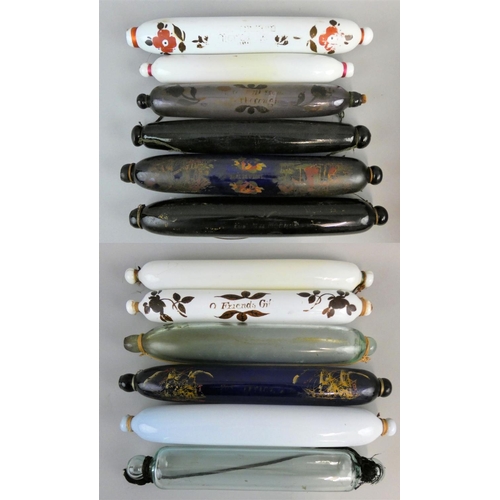 166 - A collection of Victorian glass rolling pins, decorated in various patterns to include floral and ma... 