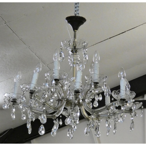 175 - An eight branch, sixteen light glass chandelier, composed of two tiers with drops beneath, diameter ... 