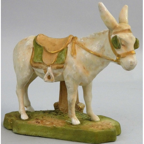 181 - A Royal Dux porcelain model of a donkey, in typical colours and with peach triangle mark for circa 1... 