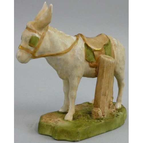 181 - A Royal Dux porcelain model of a donkey, in typical colours and with peach triangle mark for circa 1... 