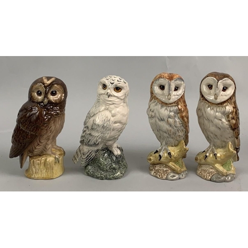 186 - A group of four Beswick Royal Doulton decanters modelled as owls, containing Whyte & Mackay or Benea... 