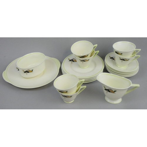 197 - A Royal Doulton Art Deco part tea set in the 'Jewel' pattern, Rd No. 776716, comprising six trios (t... 