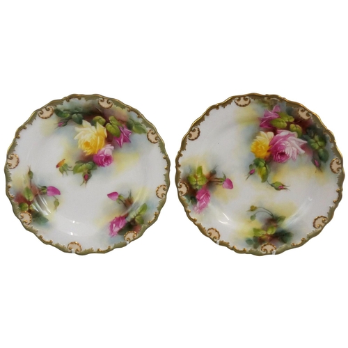 209 - A Royal Worcester pair of dessert plates, both with painted floral decoration and gilt edges, signed... 