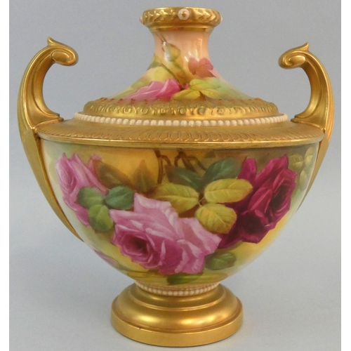 212 - A Royal Worcester blush ivory pattern vase of Grecian urn form, with a pair of upright gilt scroll h... 