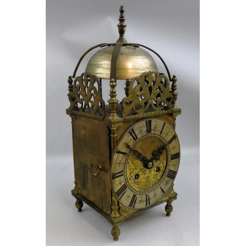 358 - A late 19th/early 20th century brass lantern clock, the silvered dial with black Roman numerals, the... 