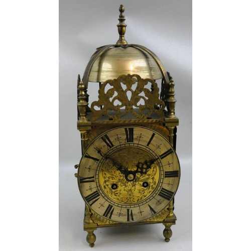 358 - A late 19th/early 20th century brass lantern clock, the silvered dial with black Roman numerals, the... 