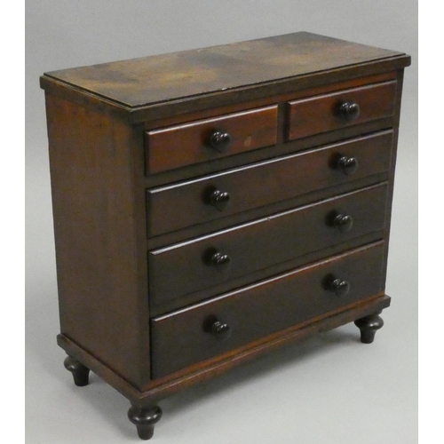 371 - An Edwardian miniature mahogany chest of four graduated long drawers, brass handles, 36 x 28 x 41 cm... 