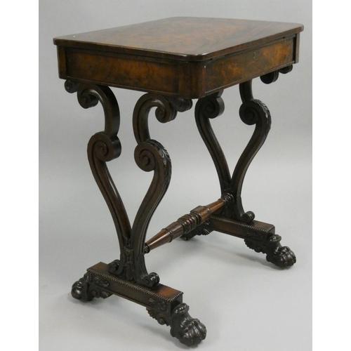 385 - A mahogany side table, the hinged rectangular top opening to reveal a compartment, to carved scroll ... 