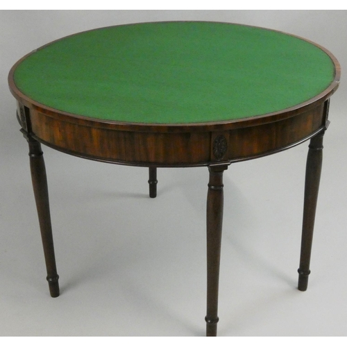 386 - A 19th century mahogany fold over D shape table, with baize cover, palmettes to the frieze, tapering... 