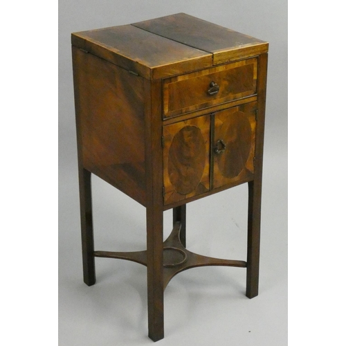 398 - A Georgian mahogany night stand, the hinged lid opening to reveal three wells over a pair of cupboar... 