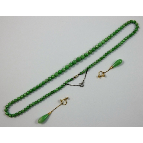 53 - A jade bead necklace, untested, composed of graduated 8 - 4 mm beads, length 50 cm, together with a ... 