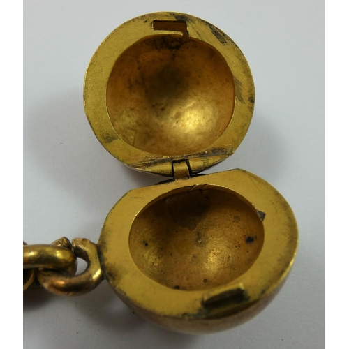 57 - A Victorian unmarked gold bracelet, the chain links with a ball slider to a ball locket below, weigh... 