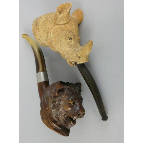 127 - A Meerschaum pipe, the bowl depicting a rhinoceros with glass eyes, 15 cm together a briar pipe with... 