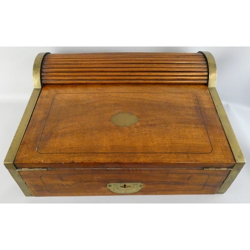 138 - A mahogany and brass band writing slope, the pull drawer lowering the tambour revealing a fitted int... 