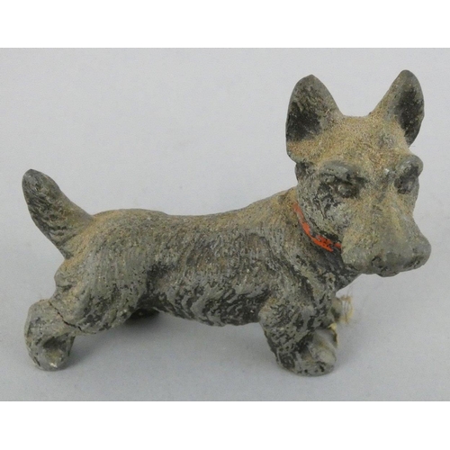 141 - An early 20th century collection of five cold painted lead dogs, to include a Scottie and a Spaniel ... 