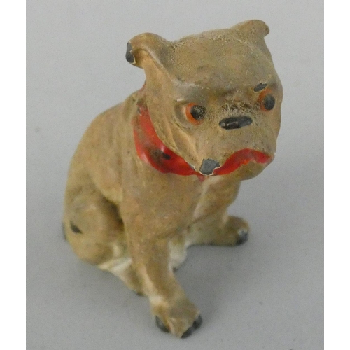 141 - An early 20th century collection of five cold painted lead dogs, to include a Scottie and a Spaniel ... 