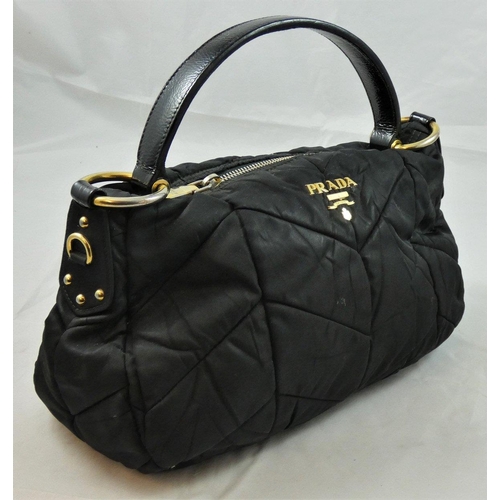 168 - Prada, a black Tessuto Quiltin nylon hand bag, model BR3774, with certificate and dust bag.