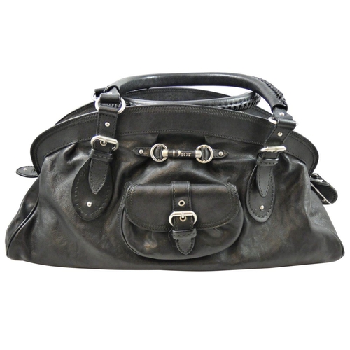 169 - Christian Dior, a black leather hand bag, serial number 01 - RU - 1006, dust bag.