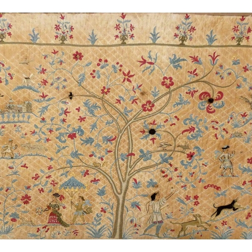 180 - An early 18th century crewelwork panel, composed of three Trees of Life, each with various people, a... 