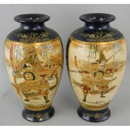 191 - A pair of Japanese Satsuma vases, Meiji period, of baluster form, over glaze decorated with Samurai,... 