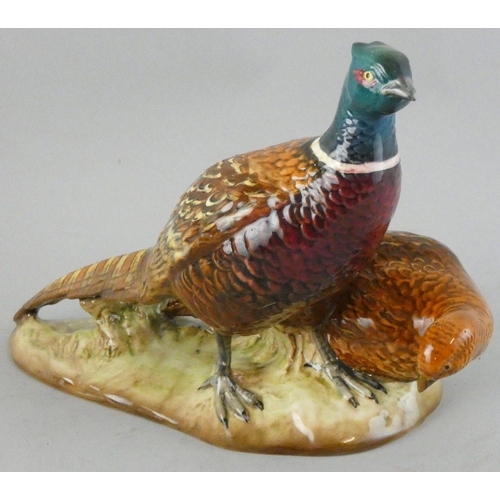 217 - A Beswick cock and hen pheasant, impressed marks, number 2078, length 25 cm.