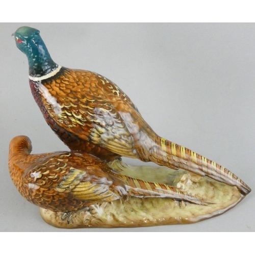 217 - A Beswick cock and hen pheasant, impressed marks, number 2078, length 25 cm.