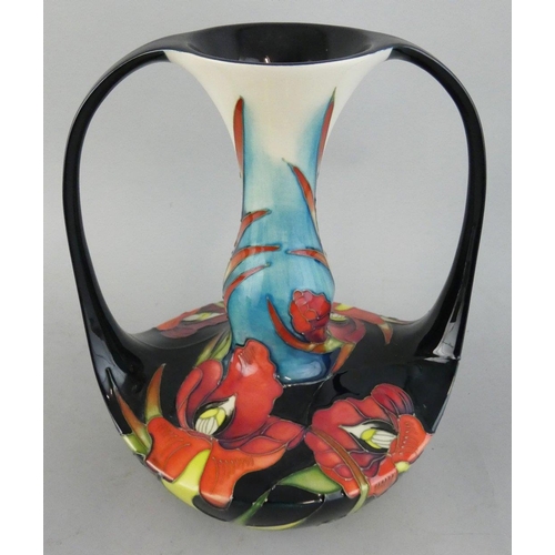 246 - A Moorcroft Satin Flowers tube lined double handled vase, designed by Nicola Slaney, shape 292/8, is... 