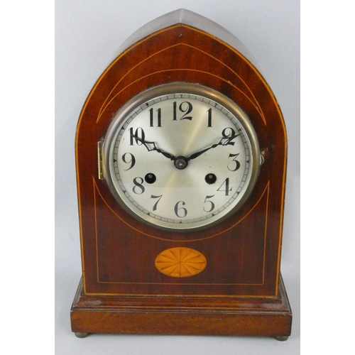 253 - An Edwardian mahogany and boxwood strung mantle clock, the silvered dial with Arabic numerals, the m... 