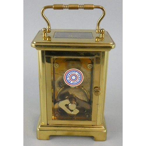 264 - An Edwardian gilt metal and blue enamel boudoir 8 day time piece with ornate frame, height 13.5cm