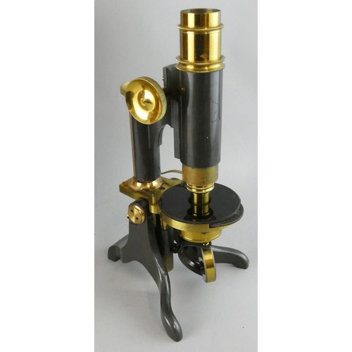 278 - An early 20th century monocular brass and steel microscope, unsigned, together with two lenses, maho... 