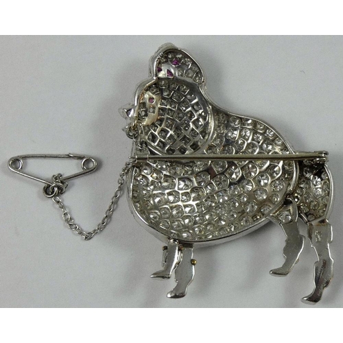 100 - A large platinum and diamond set poodle brooch, c.1940, set with mainly brilliant cut diamonds, sing... 