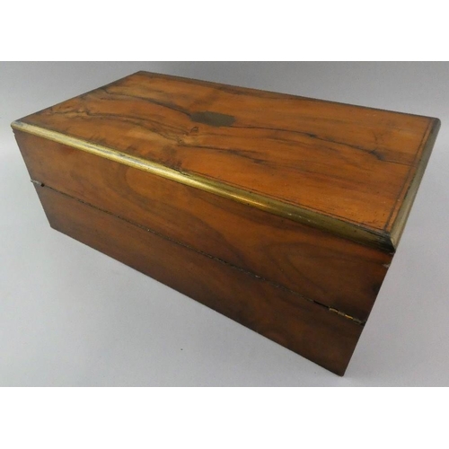 142 - A Victorian rosewood and brass inlaid writing slope, opening to reveal an ebonised interior with a l... 