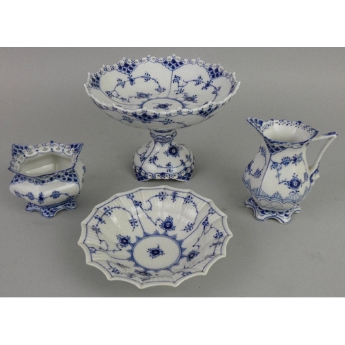 167 - A Royal Copenhagen porcelain tazza, in the Lace and Devil pattern, 1020, a bowl, 141, a sugar bowl, ... 