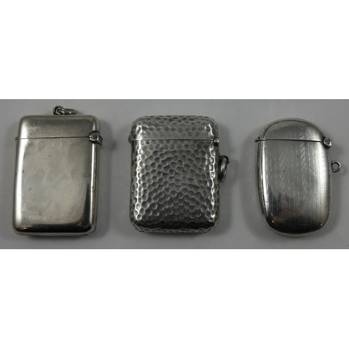 28 - An Edwardian silver vesta case, by S. Mordan & Co. Chester 1905, with hammered finish and two other ... 