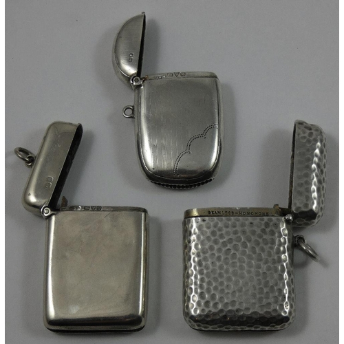 28 - An Edwardian silver vesta case, by S. Mordan & Co. Chester 1905, with hammered finish and two other ... 