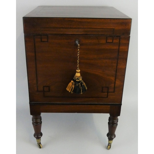 280 - An Edwardian mahogany square cellarette, the boxwood strung lid opening to reveal nine bottle compar... 