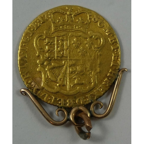 80 - George III half guinea, 1786, mounted.