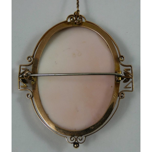 91 - A Victorian rose gold conch shell cameo brooch, depicting a classical lady, scroll mount, 6 x 5 cm.