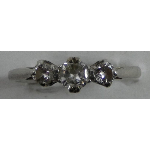 92 - A platinum and diamond three stone ring, claw set with graduated brilliant cut stones, total weight ... 