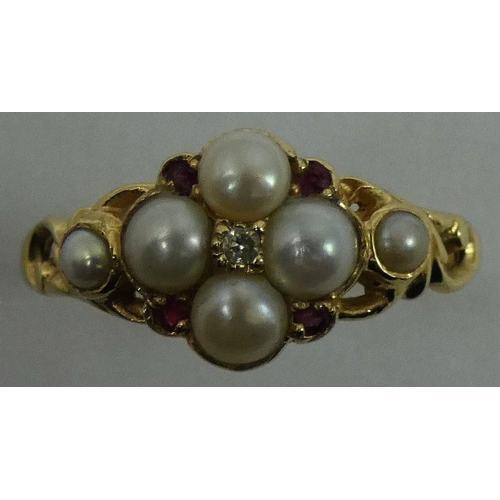 95 - A Victorian gold pearl and diamond cluster ring, ruby points, size P 1/2.