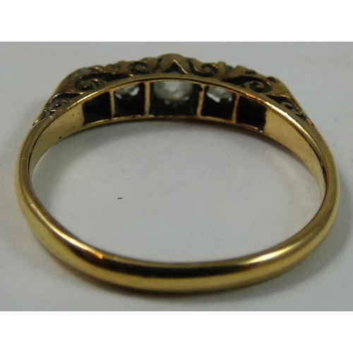 96 - A Victorian 18ct gold five stone diamond ring, carved claw set with graduated old cut stones, total ... 