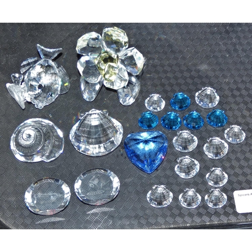 60 - A Swarovski butterfly and a flower together with sea shells, blue heart cruise souvenir 2001 etc