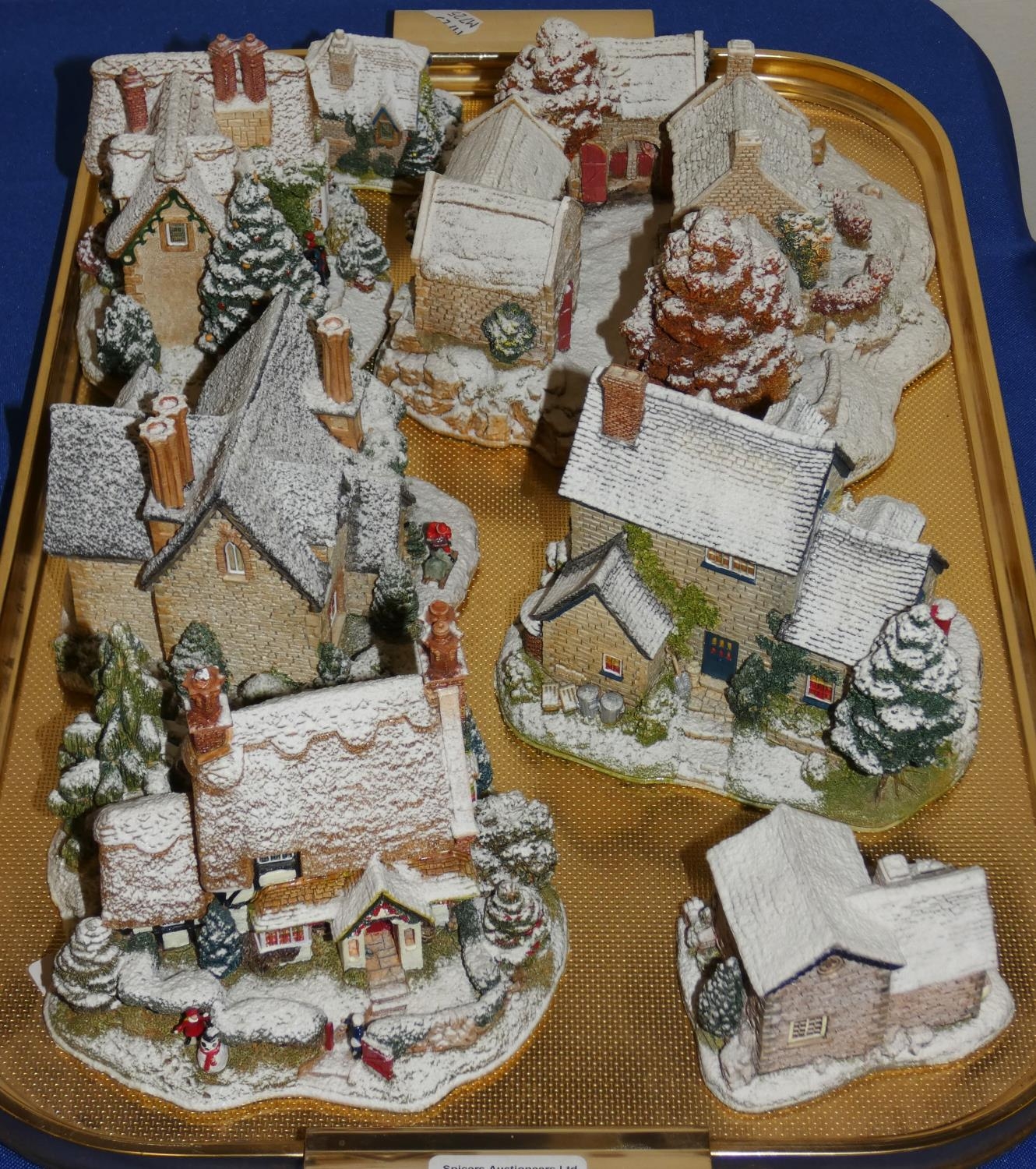 A collection of Lilliput Lane Christmas cottages, including