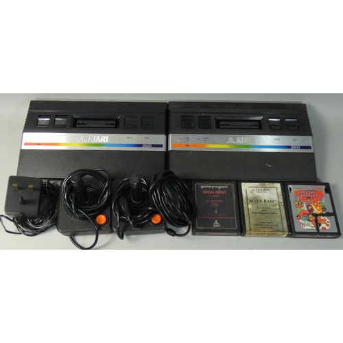 127 - Two Atari 2600 JR games consoles, together with two controllers, television lead, Tadmod power suppl... 