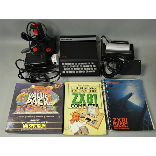 121 - A Spectrum ZX-81 personal computer with 16K expansion ram and power supply unit, housed within origi... 