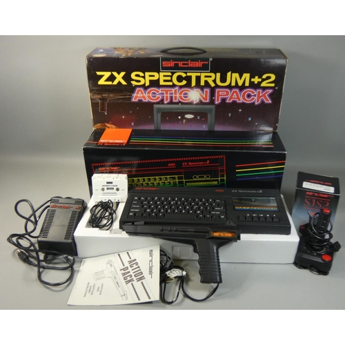 119 - A boxed Sinclair ZX Spectrum+2 Action Pack, with power supply unit, television lead, manual, light g... 